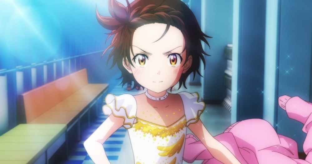 A determined young girl in an elegant ice skating costume, showcasing a fierce expression, stands in an ice rink corridor.