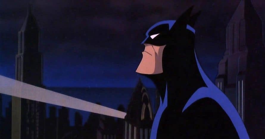 A cartoon depiction of a superhero in a dark costume, gazing over a city skyline at night, with a spotlight shining in the background.