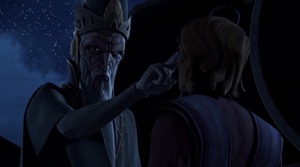 A tall, otherworldly figure with a crown gestures with a pointed finger toward a younger man in a dimly lit setting, surrounded by stars.